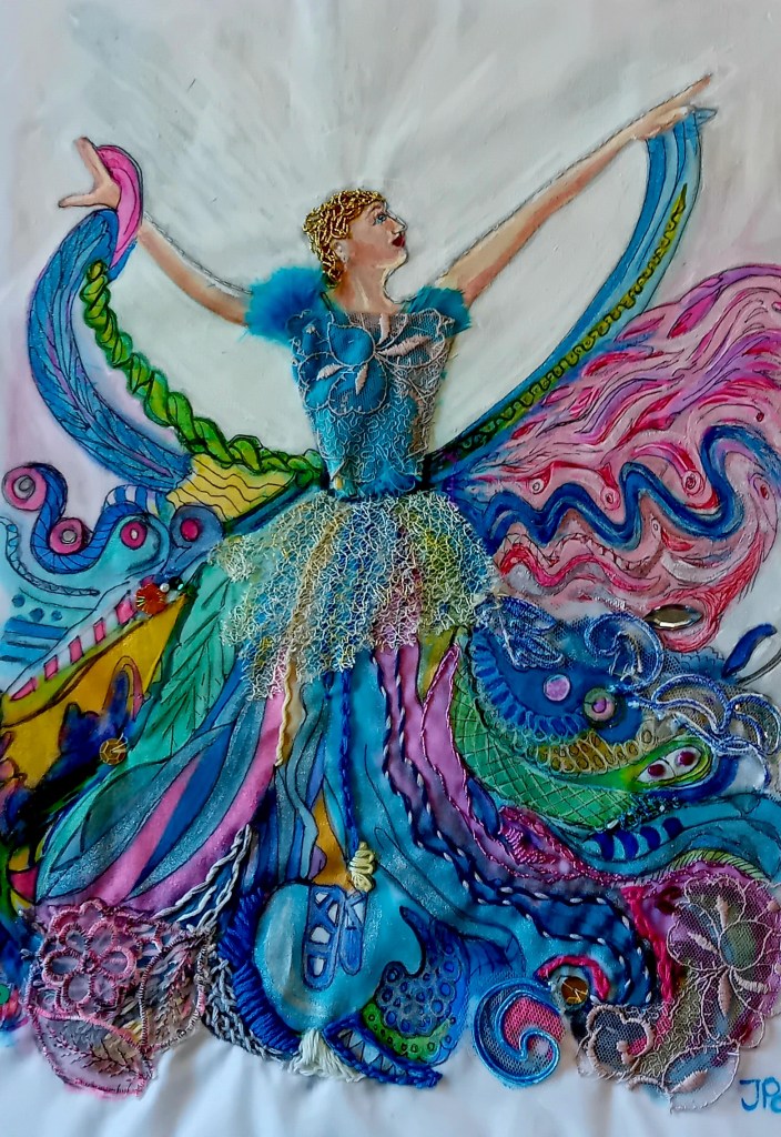 Image of lady on fabric with embroidery and collaged materials mainly pink and blue