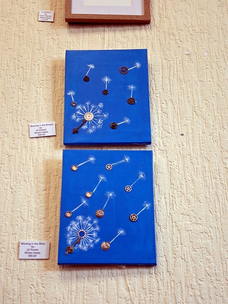Clock pieces surrounded by whits acrylic paint to resemble dandelion clocks