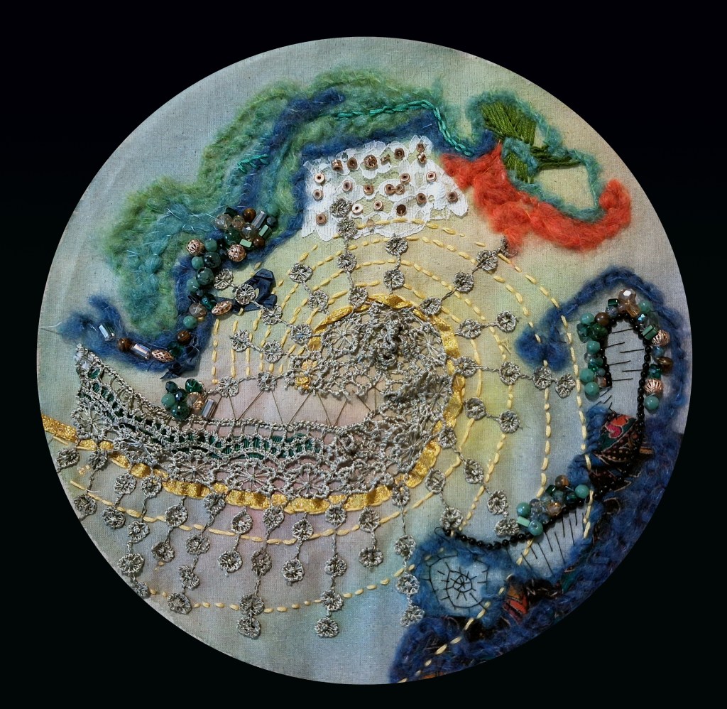 An experiment with silks, wool and beads on calico, faintly resembling a planet